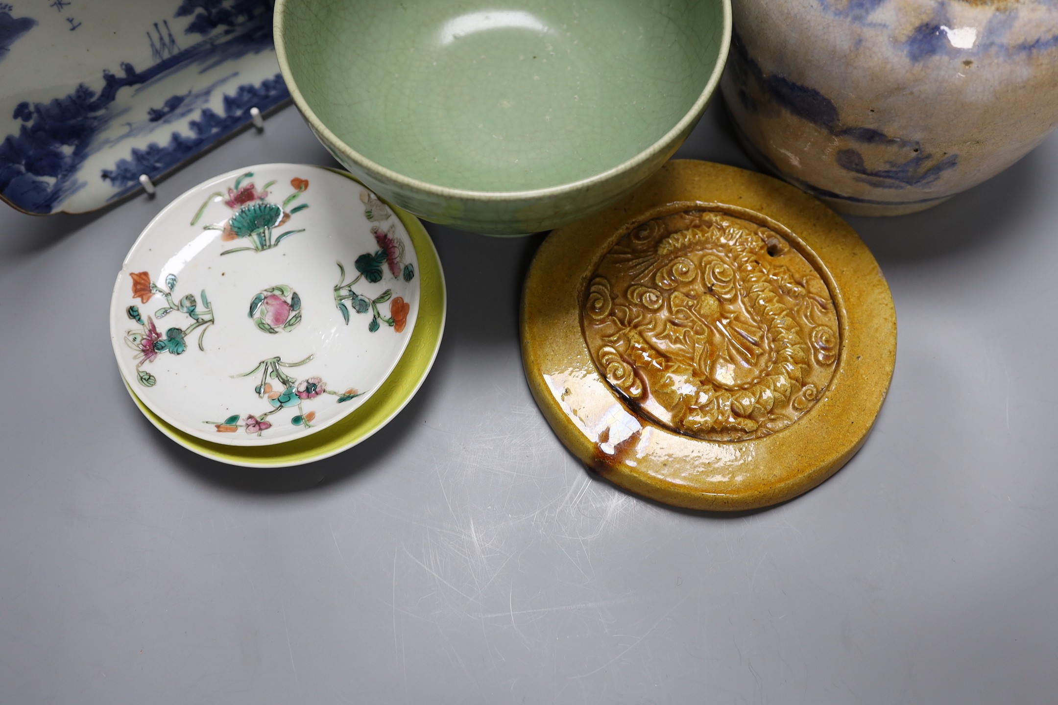 A celadon crackle glaze pedestal bowl, together with a blue and white inscribed dish, a 19th century famille verte dish and others (6)